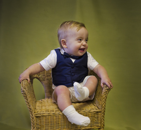 Cute, young page boy in bow tie and waistcoat