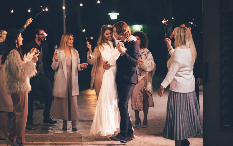 Bride and groom dancing outdoors