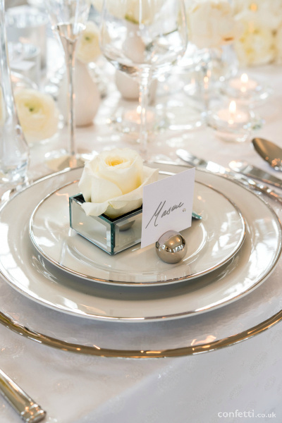 Reception decor with winter white flowers from Confetti.co.uk