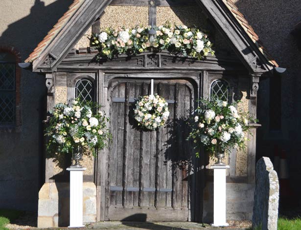 Church door flowers by The Bespoke Florist | Confetti.co.uk