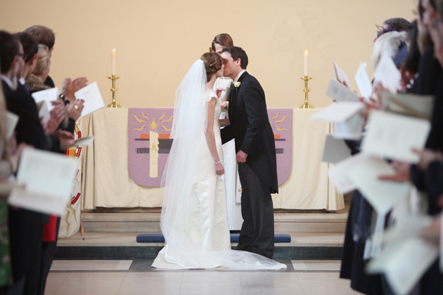 bride and groom first kiss