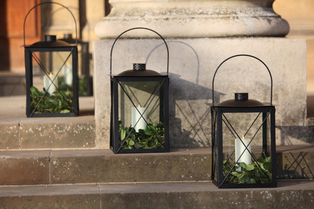 Black Lanterns with white candles on steps