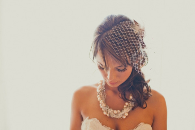 Pretty bride wearing veil and jewellery