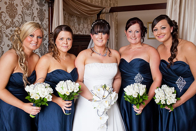 bride and bridesmaids in navy blue