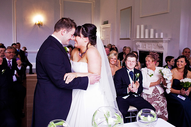 bride and groom laugh during ceremony