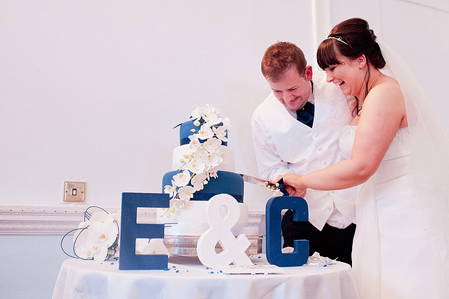 bride and groom cutting modern wedding cake