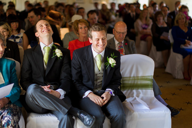 Groomsmen Laughing At Wedding Ceremony