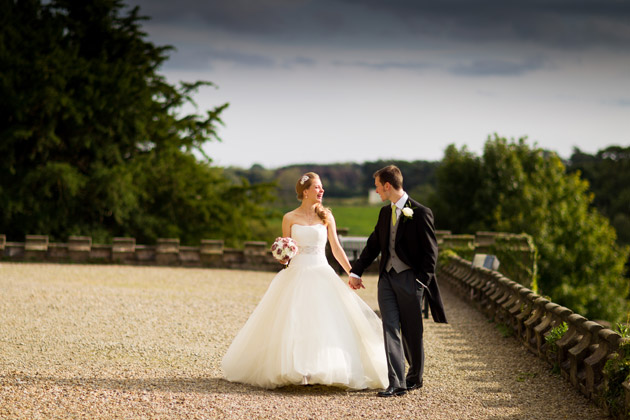 Newlyweds Walking Outside Wedding Venue