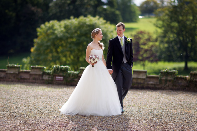 Newlyweds Walking Outside Wedding Venue