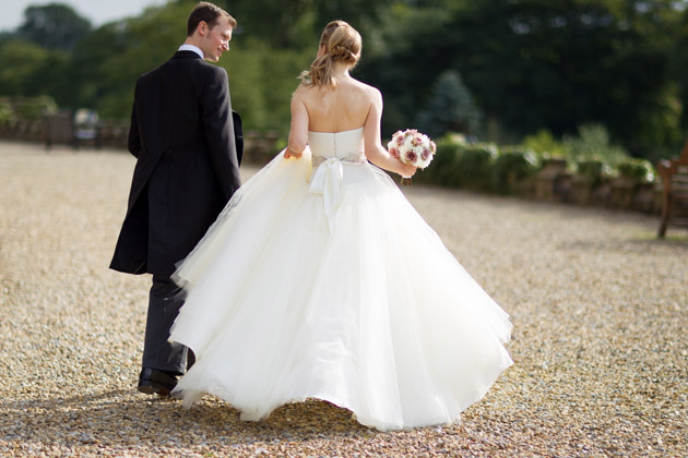 Newlyweds Walking Outside Wedding Venue