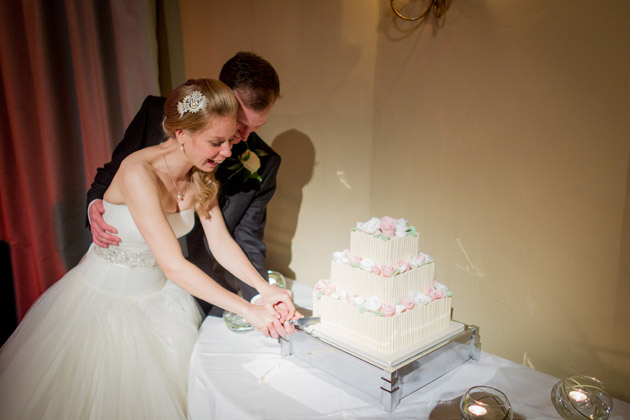 Newlyweds Cutting Wedding Cake