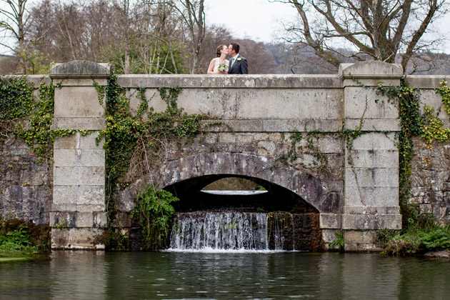 Bride and Groom Kissing on Bridge