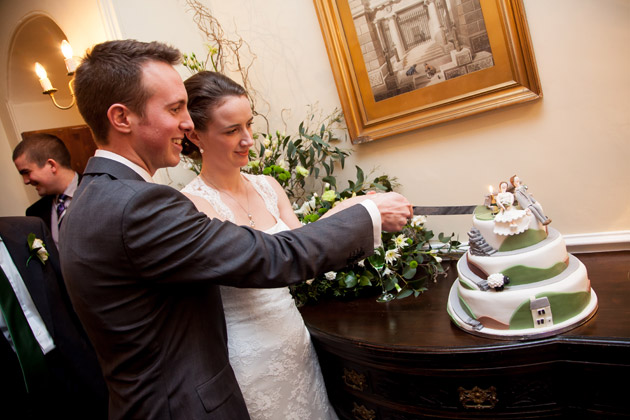 Bride and Groom Cutting the Cake