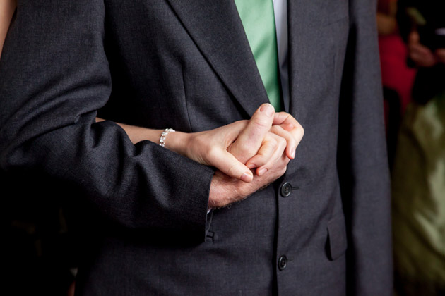 Bride and Father Holding Hands