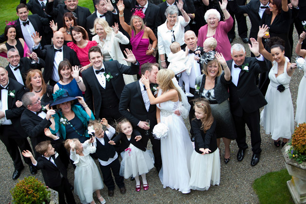 Bride and Groom With Guests Outside