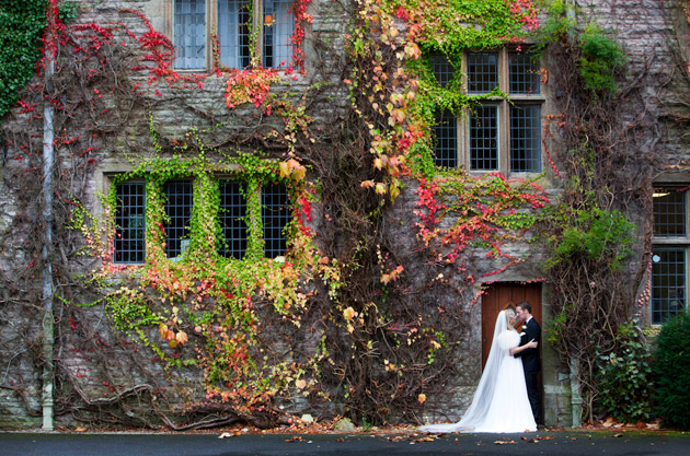 Bride and Groom outside the ivy wrapped Armathwaite Hall