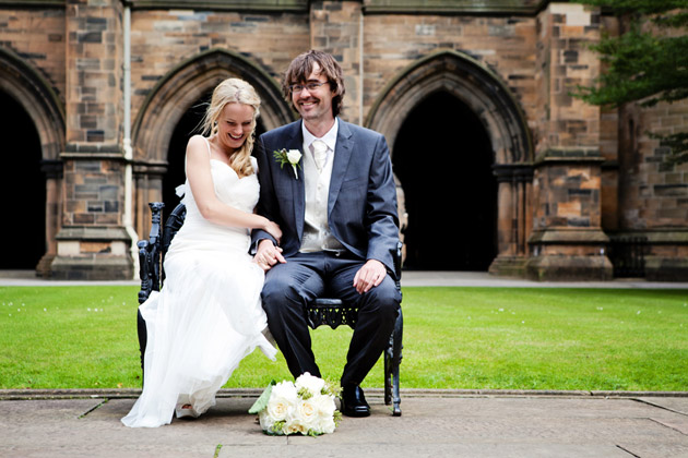 Bride And Groom Laughing on Bench