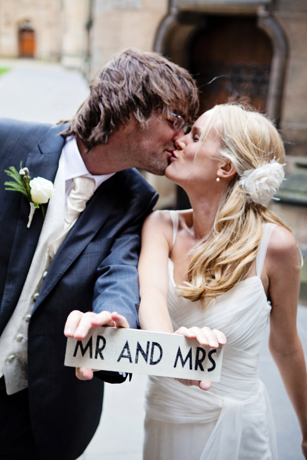 Bride And Groom With Mr & Mrs Sign