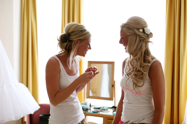 Bride and Bridesmaid Getting Ready