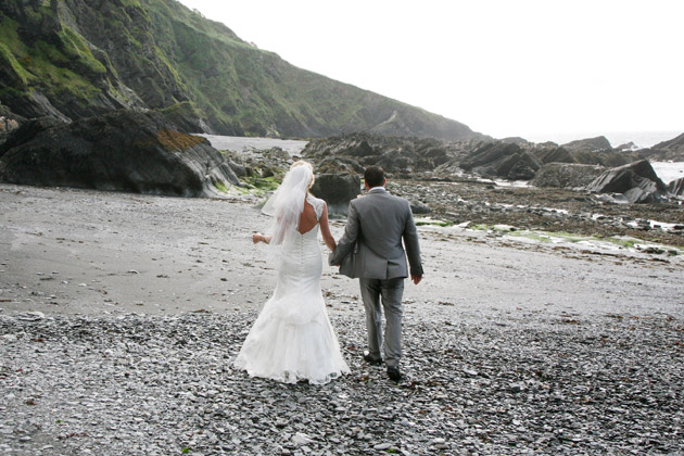 Bride and Groom Walk on Beach