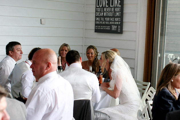 Bride Talks to Guests at Reception