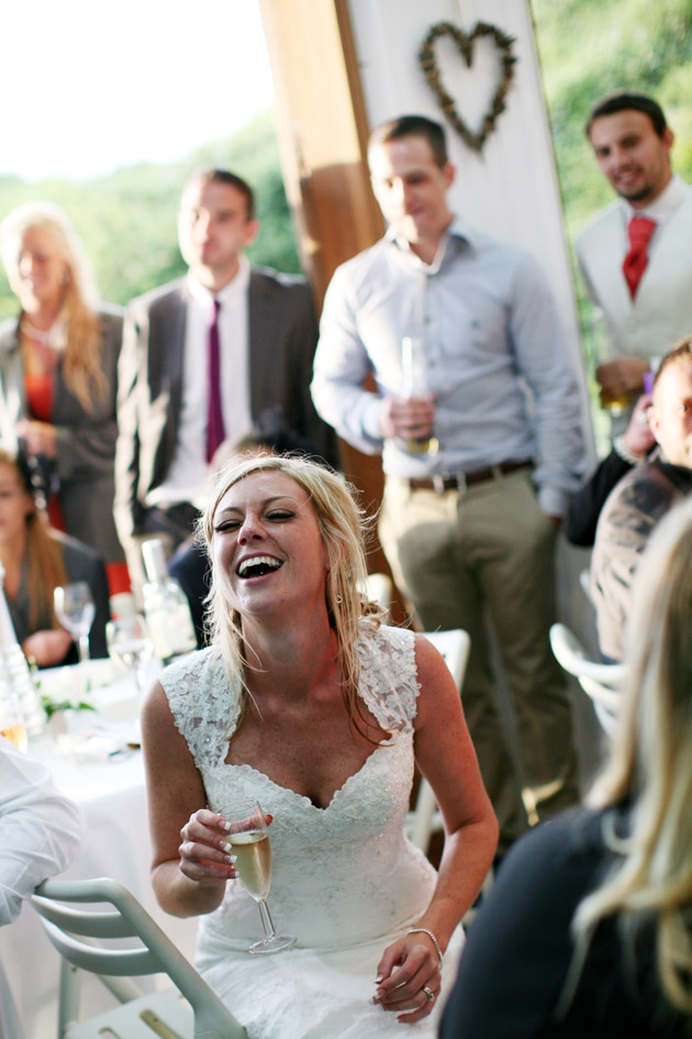 Bride Laughing at Wedding Speech