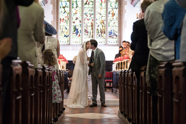 Bride and Groom First Kiss at the Altar