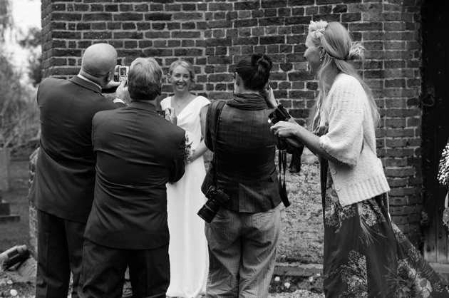 Guests Taking Photos of the Bride