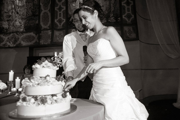 Bride and Groom Cutting the Cake