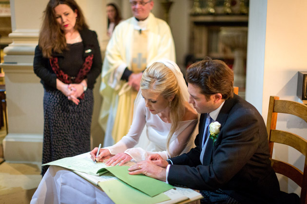 Newlyweds Sign the Register