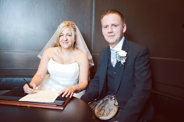 Bride and Groom Signing the Register