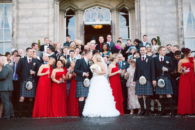 Bride and Groom Kiss Outside the Castle