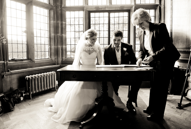 Bride and Groom Sign The Register