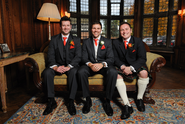 Groom and Grooms-men wearing orange ties 