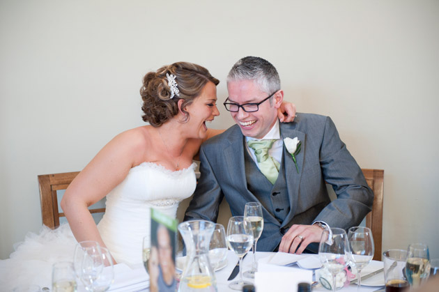 Bride And Groom Laughing at Speeches