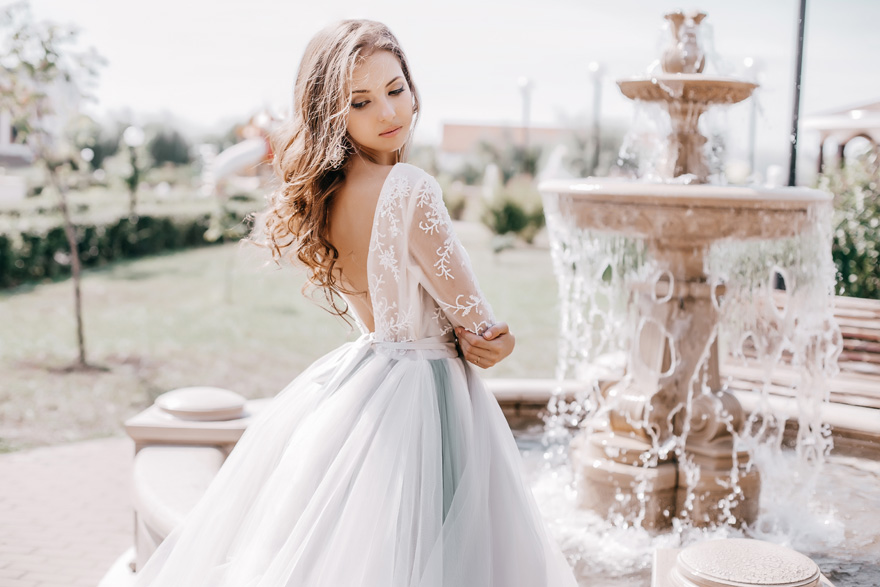 Beautiful Bride by a Fountain - Princess Wedding Dresses from Shutterstock | Confetti.co.uk