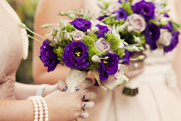 Bridesmaid’s purple bouquets 