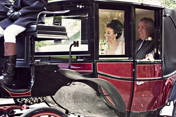 Bride in wedding horse and carriage 