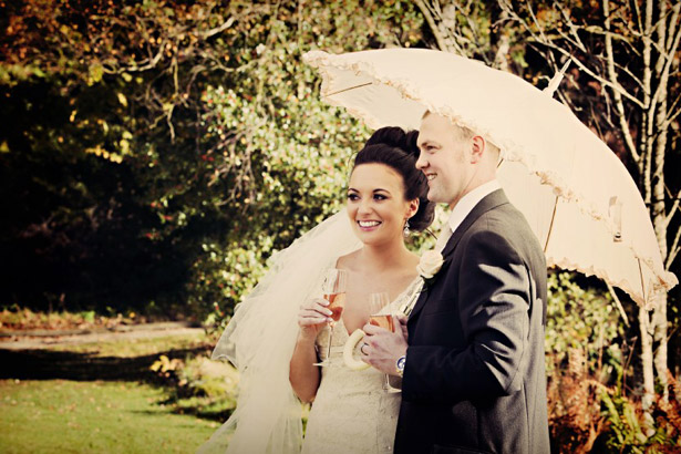 Newlyweds with parasol 