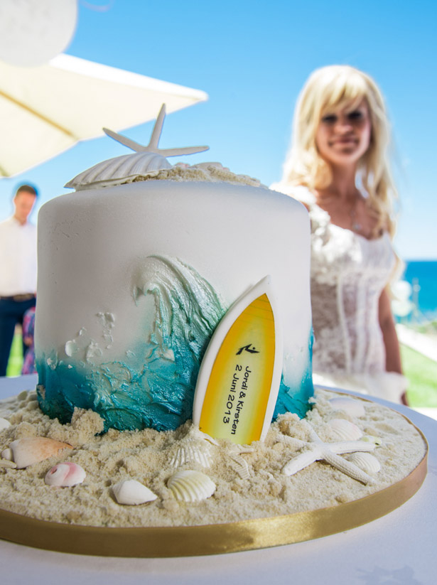 Bride with beach wedding cake