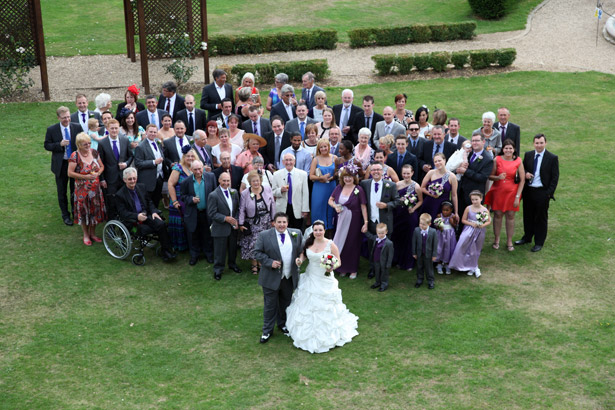 Bride and groom with wedding guests