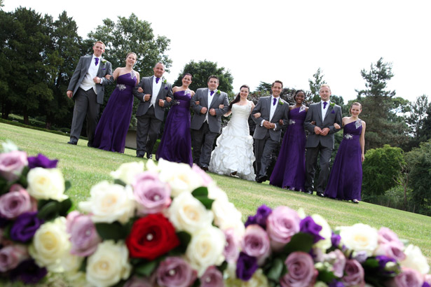 Bride and Groom with wedding guests, lavender and white bouquet