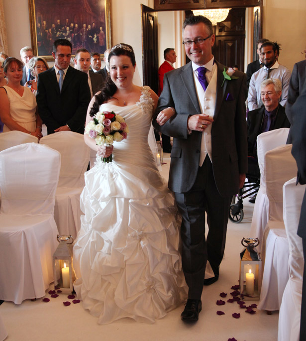 Bride at ceremony with father