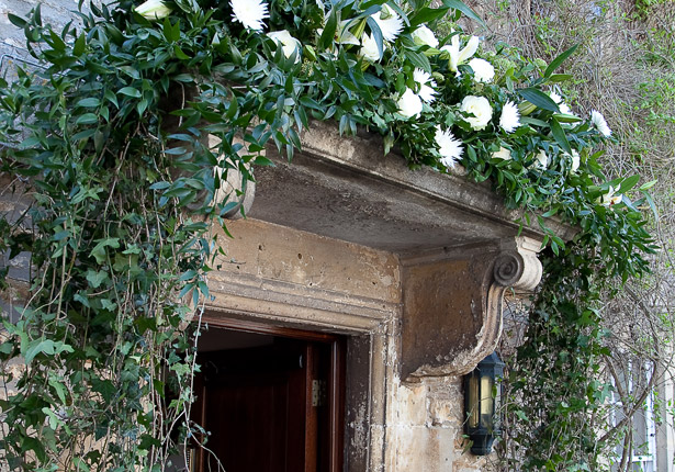 Bride's Hotel White Flowers on the Carved Stone Doorway Arch