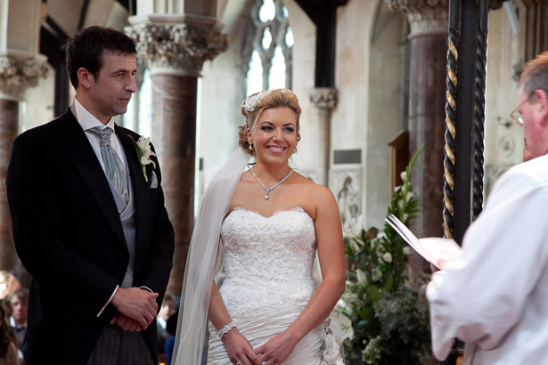 Bride And Groom Saying Vows in front of Priest