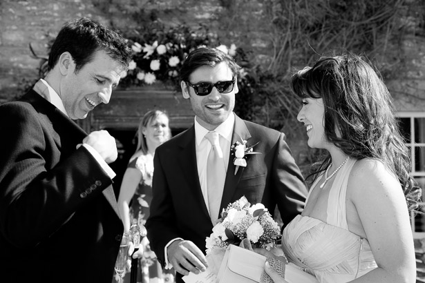 Groom Laughing With Guests