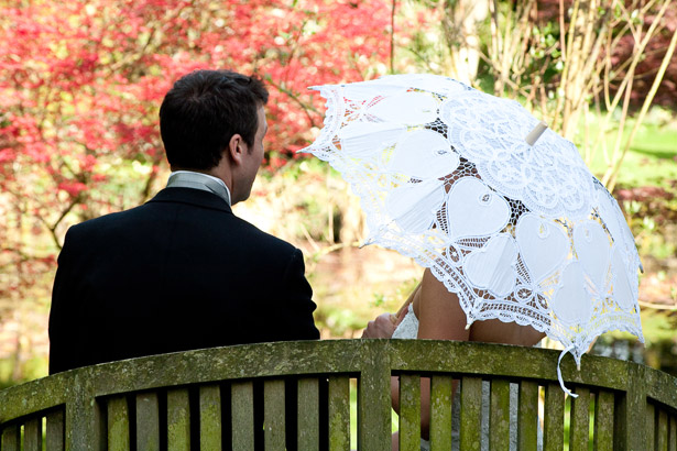 Bride And Groom On Garden Bench