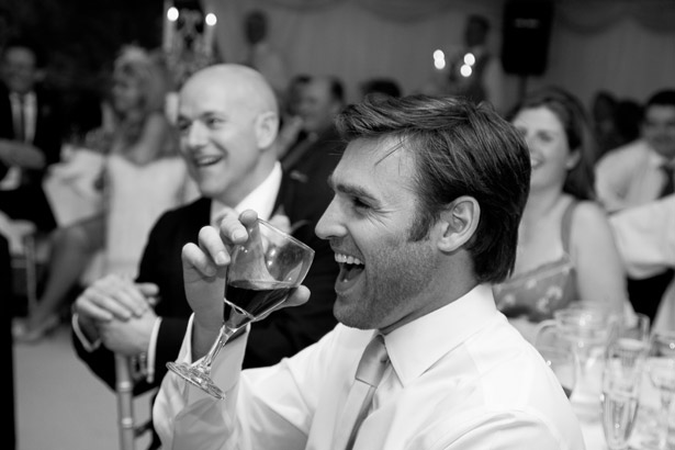 Guests Laughing At Wedding Speech