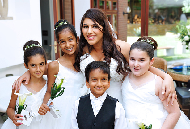 Bride with flower girls and usher