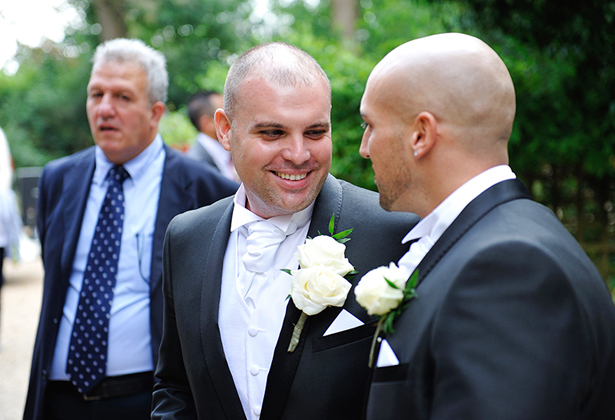 Grooms and bestman outside the church